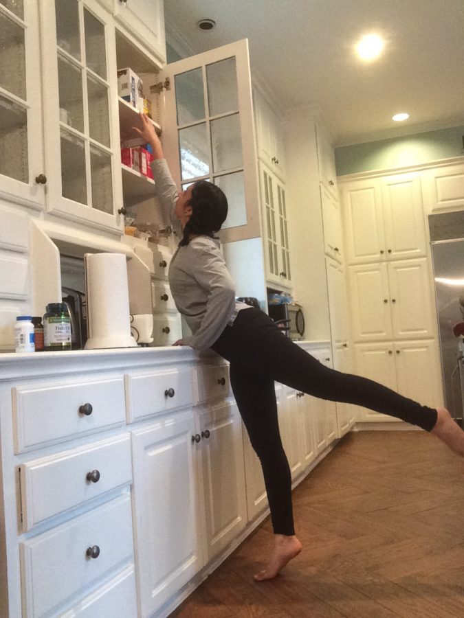 Gupta takes a photo for her dance assignment. Students were assigned to photograph themselves in a dance position around the house