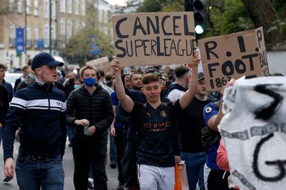 Protests against European Super League outside of Stamford Bridge football stadium in London on April 20, 2021.