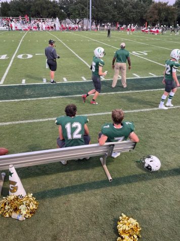 Bennett Broaddus (22) and Gideon Myers (22) sitting on the bench during the football game against St. Johns School.