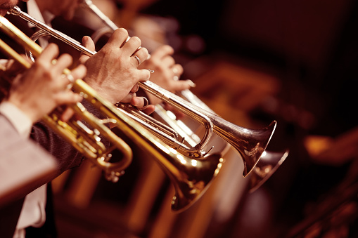 Hands trumpeters  in the orchestra closeup