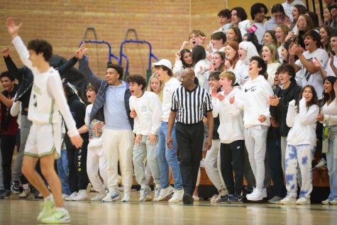 Greenhill Upper School students cheer on the Boys Varsity Basketball Team during the white out game. 