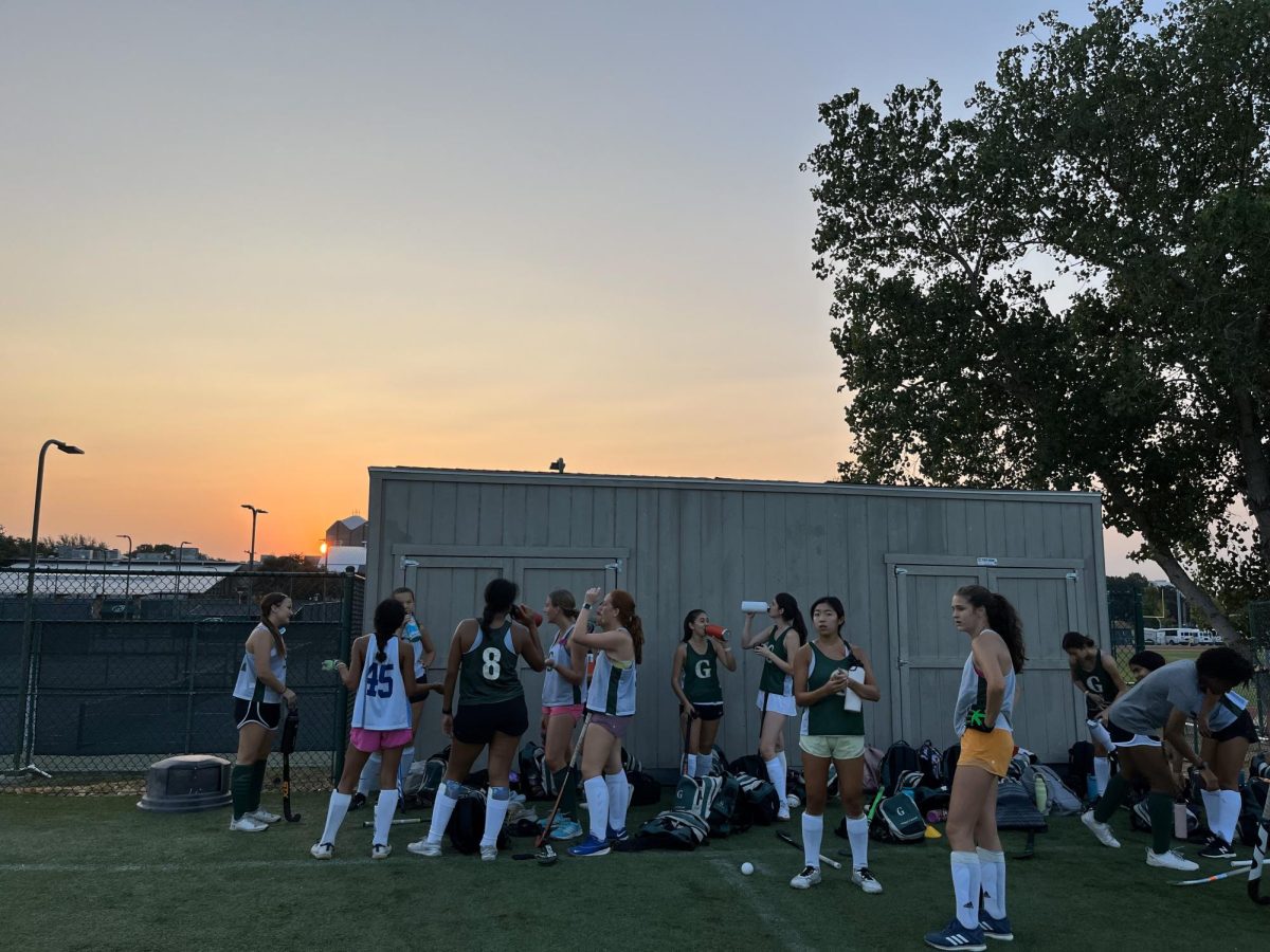 Girls varsity field hockey arrives at practice before the sun rises. 