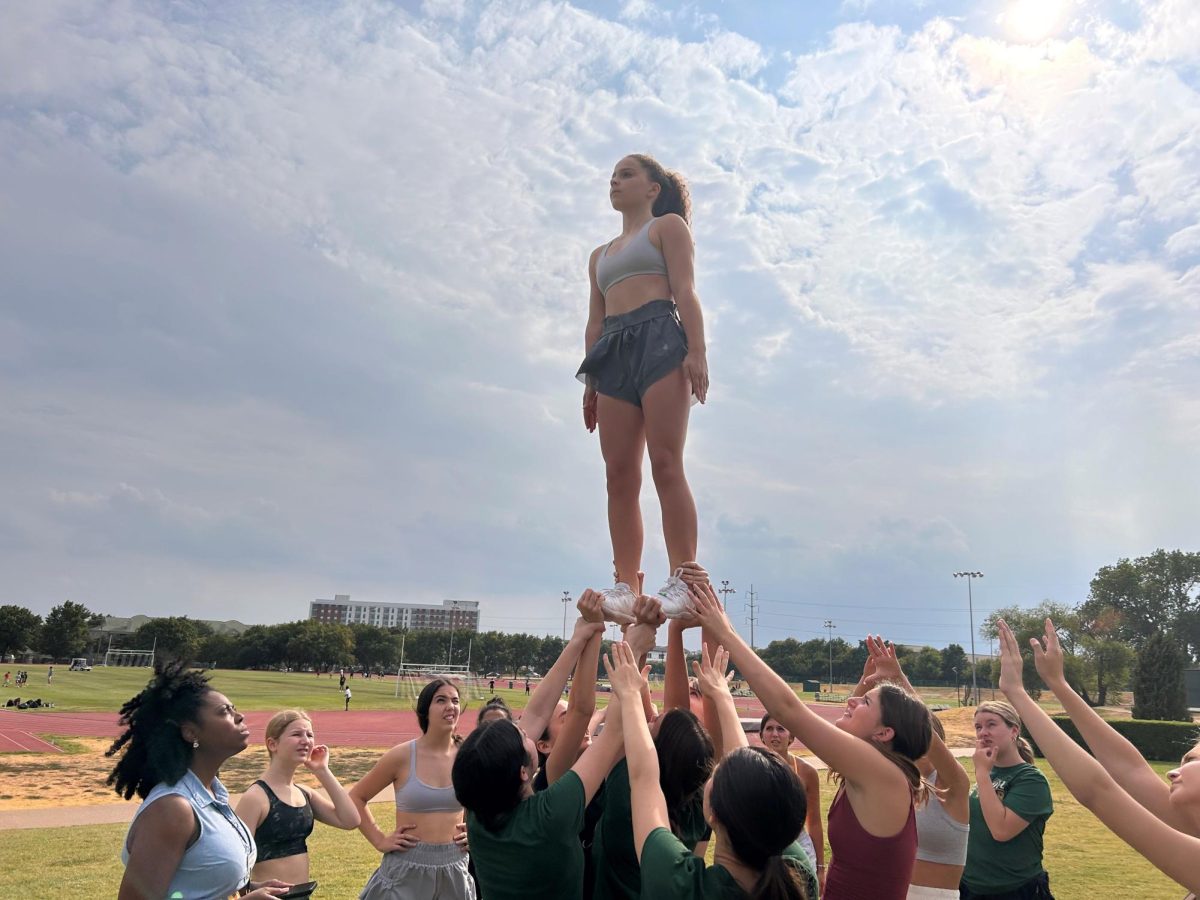 Greenhill cheer practices stunts for their performance during the Upper School homecoming pep rally.