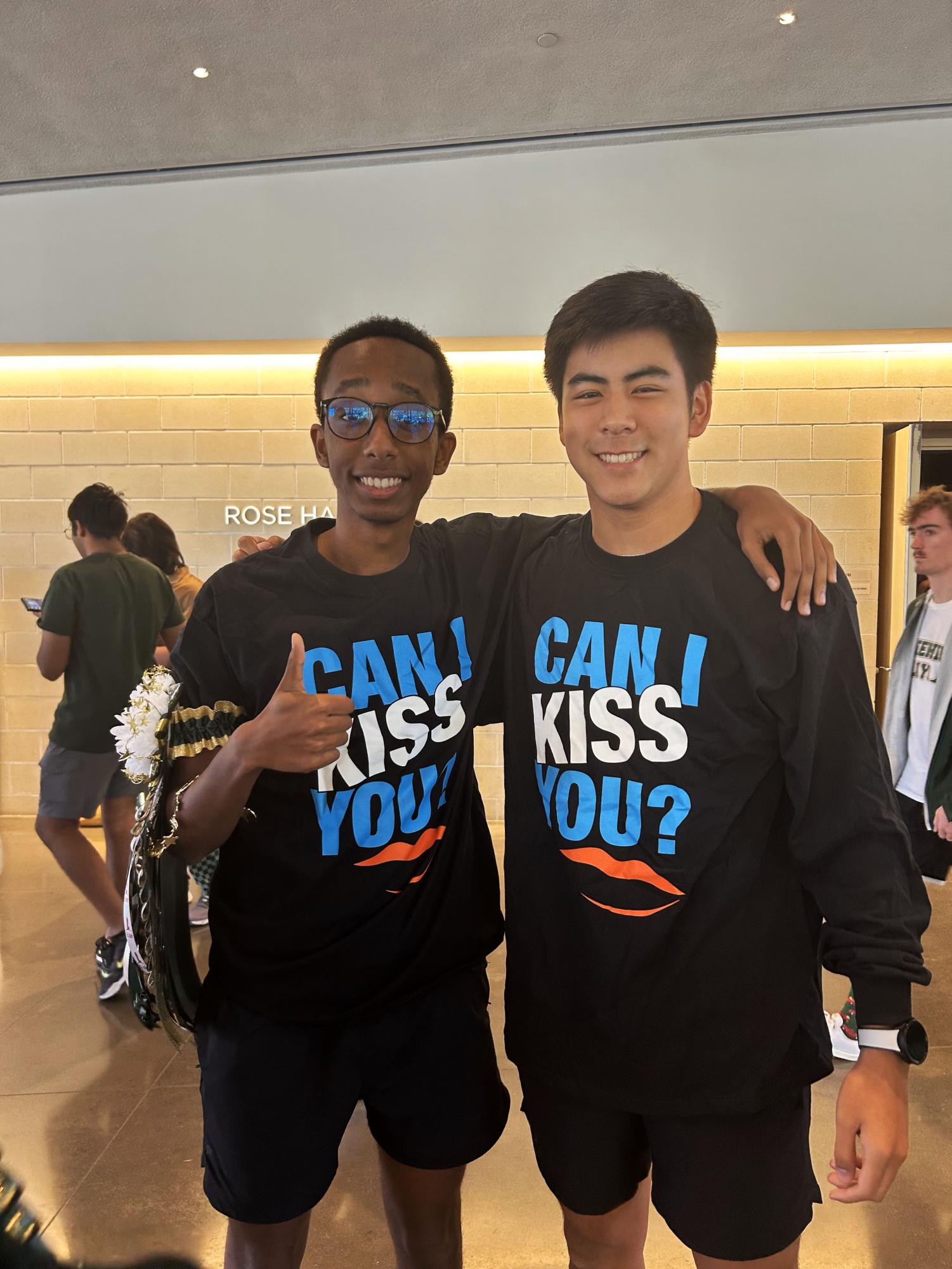 Senior students receive Can I Kiss You? merchandise during the presentation after answering a question. Photo courtesy of Iyad Mohammed.