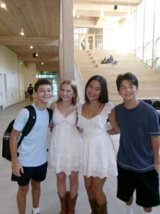 Freshmen Pierson Reiman and Carson Yoo pose with their senior sisters Dani Reiman and Kaitlyn Yoo on the first day of school.